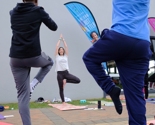 Outdoor yoga on the grass during our Meet and Greet event.