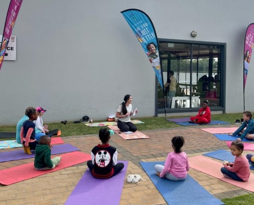 Listening with rapt attention before exercising on the mats.